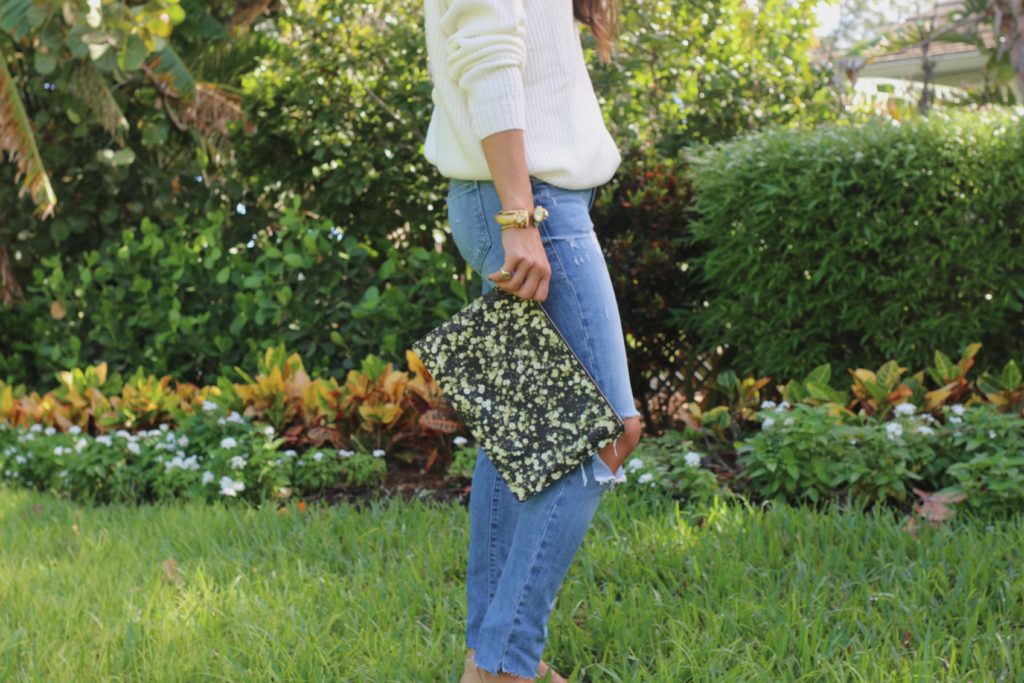 clutch + jeans + backless sweater