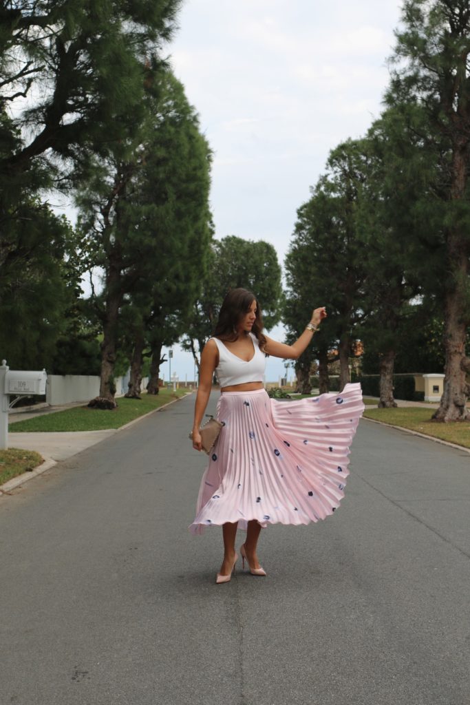 pink pleated skirt twirl